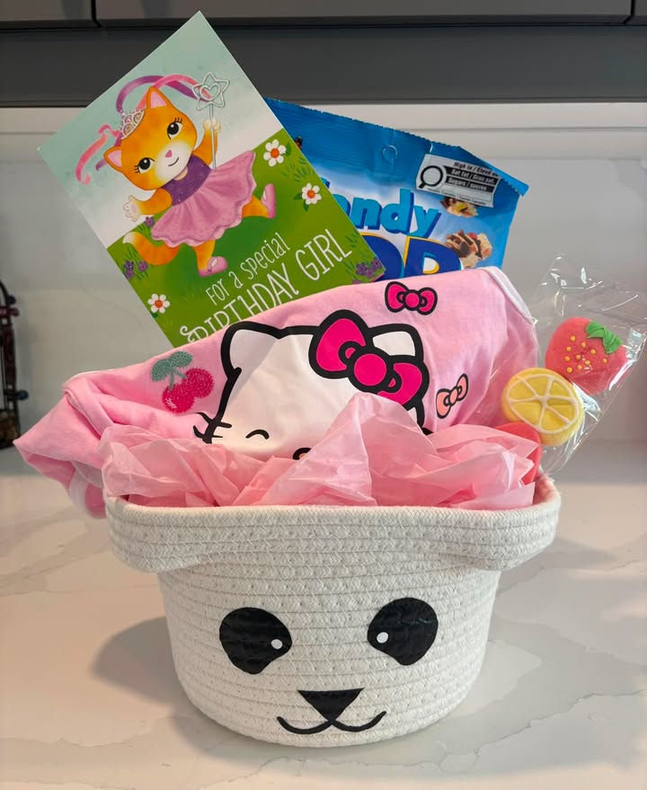 Birthday basket with Hello Kitty shirt, card, candy, and decorated cookies